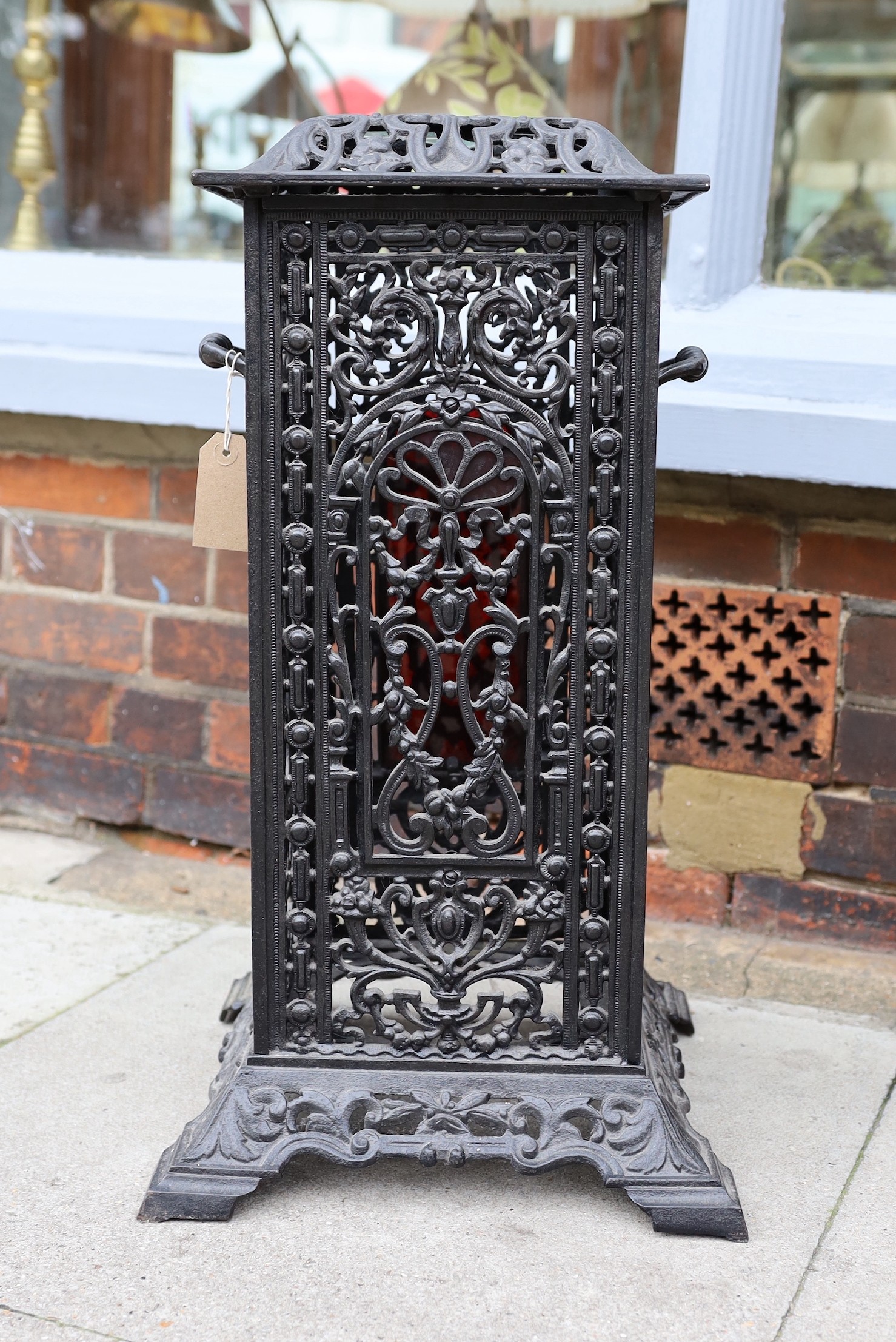 A Victorian cast iron conservatory heater, with the later glazed top, height 61cm. width 36cm